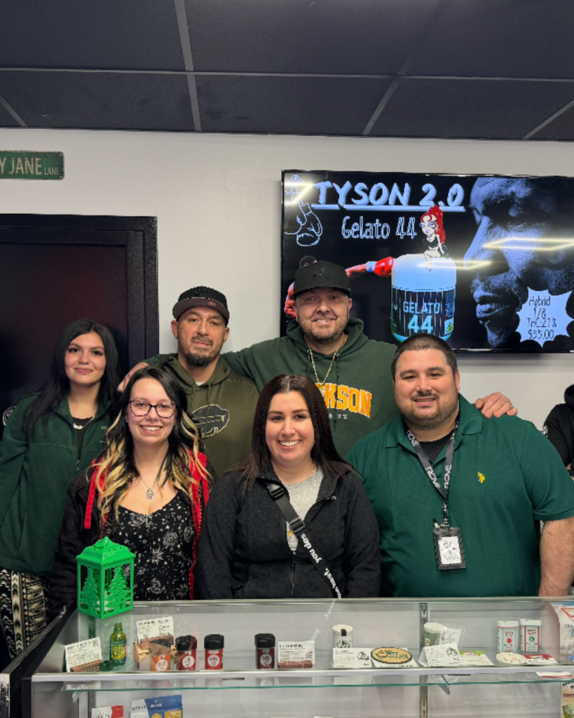 Staff at Mary Jane’s A Legacy 2 Legal Dispensary gathered inside the store for a photo in celebration of the dispensary’s one-year anniversary, honoring a successful first year in business and the relationships built with the community.